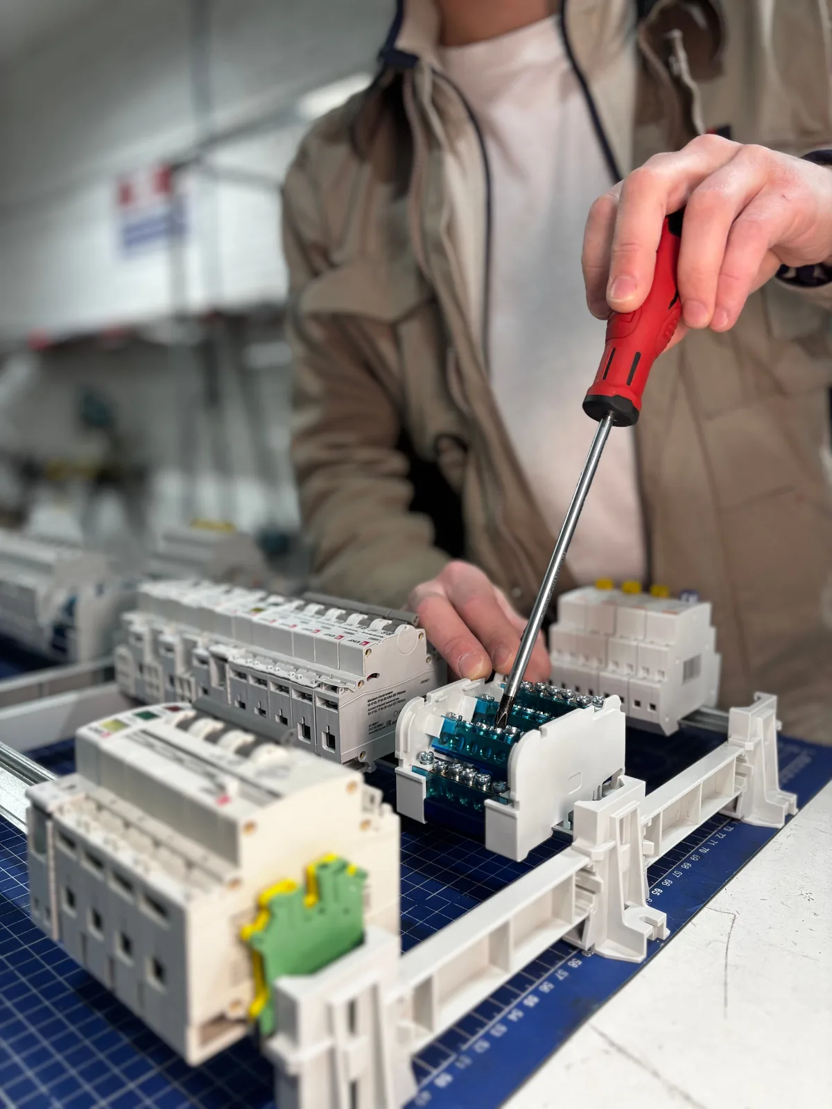 Breakers assembled on a DIN rail before installation, for licensed electrician in London