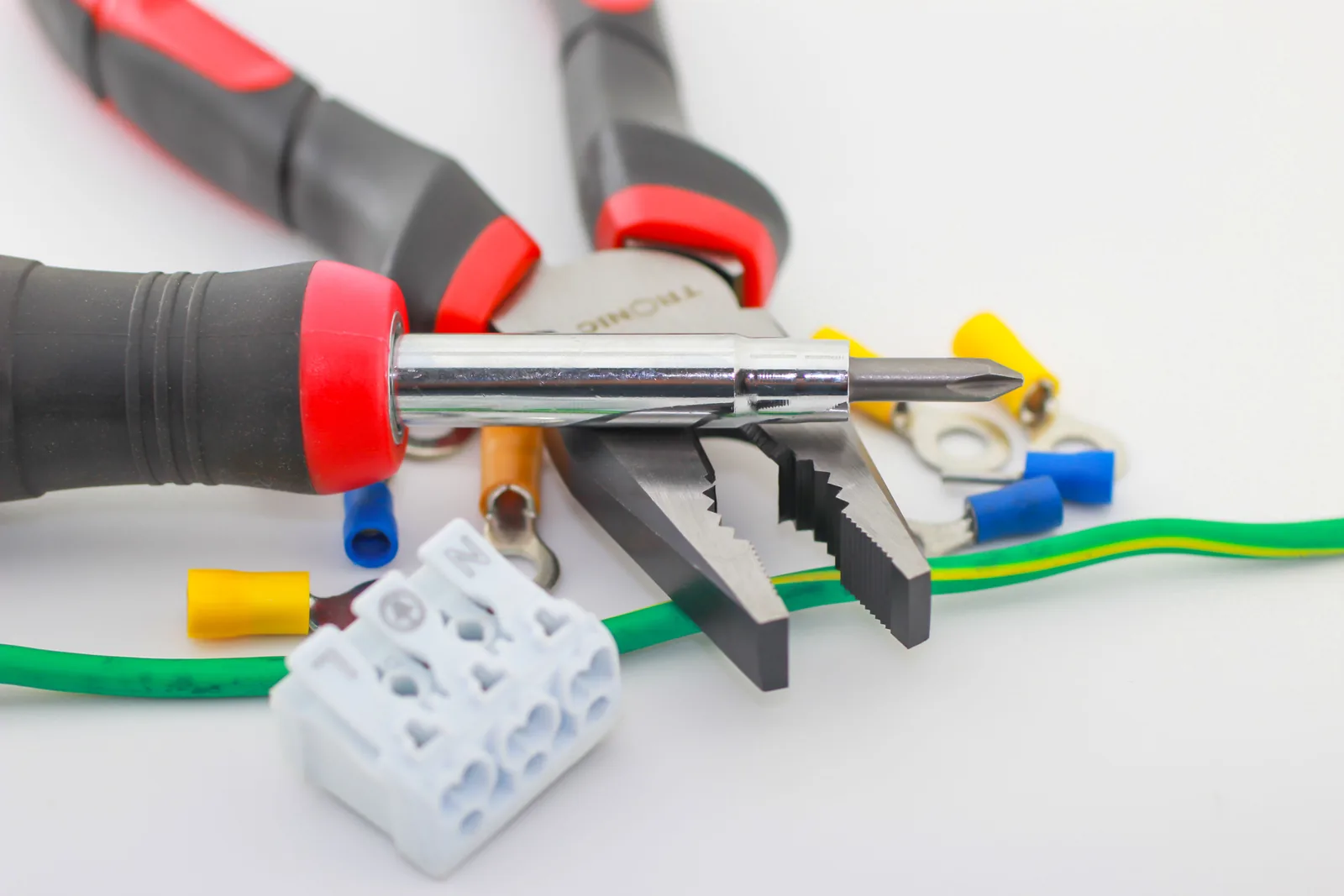 Pliers, a screwdriver, ferrules and a connector block, for electrician in London