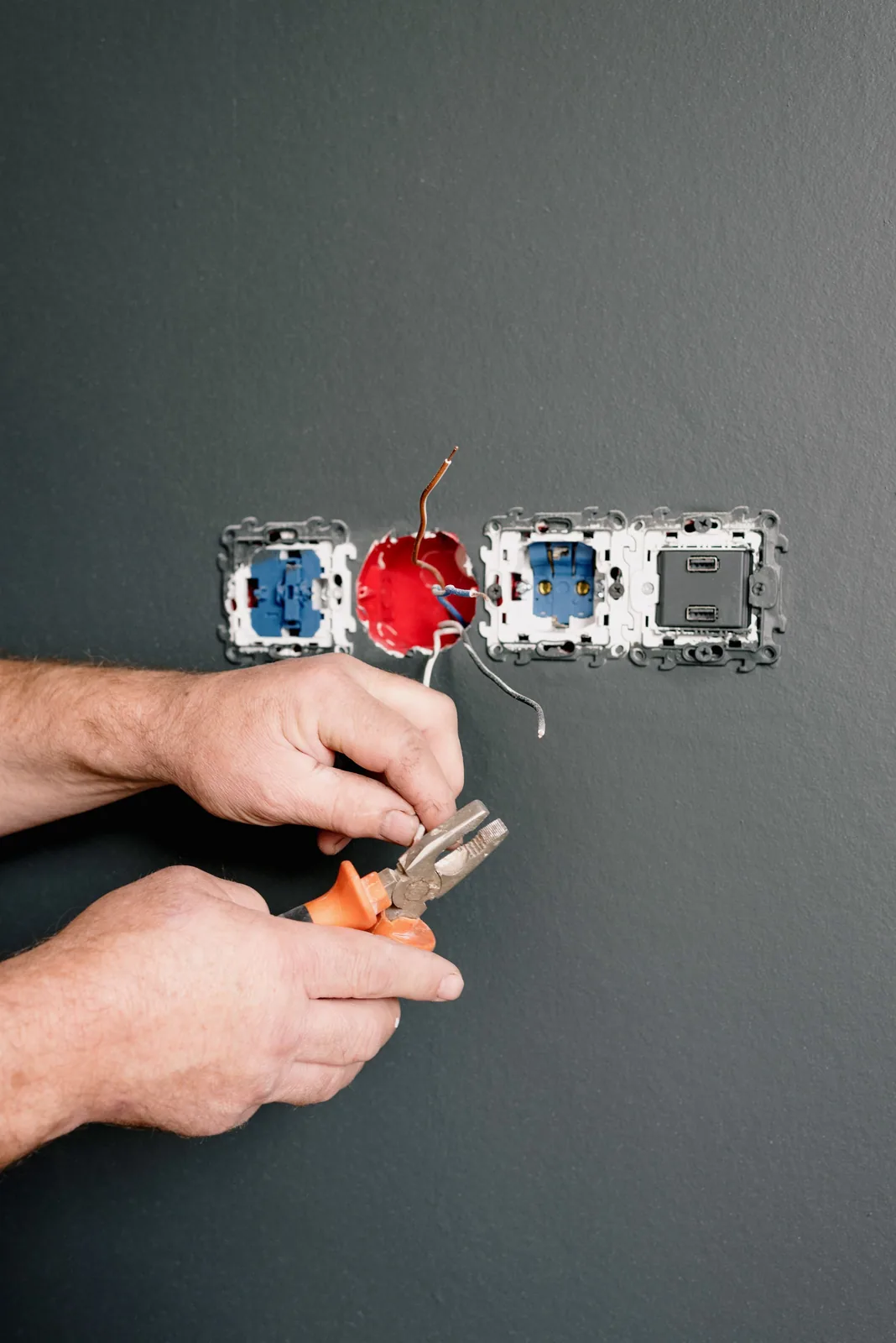 Wiring an outlet box into a finished wall, for code violation in London